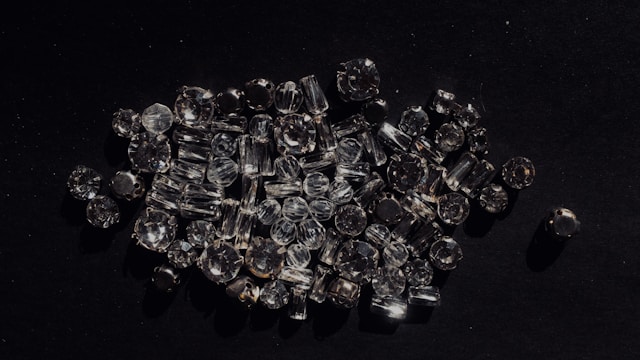 A small collection of diamonds on a black background.