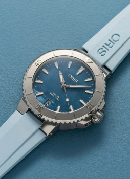 An Oris watch with a blue strap, available at Wilson & Son Jewelers.